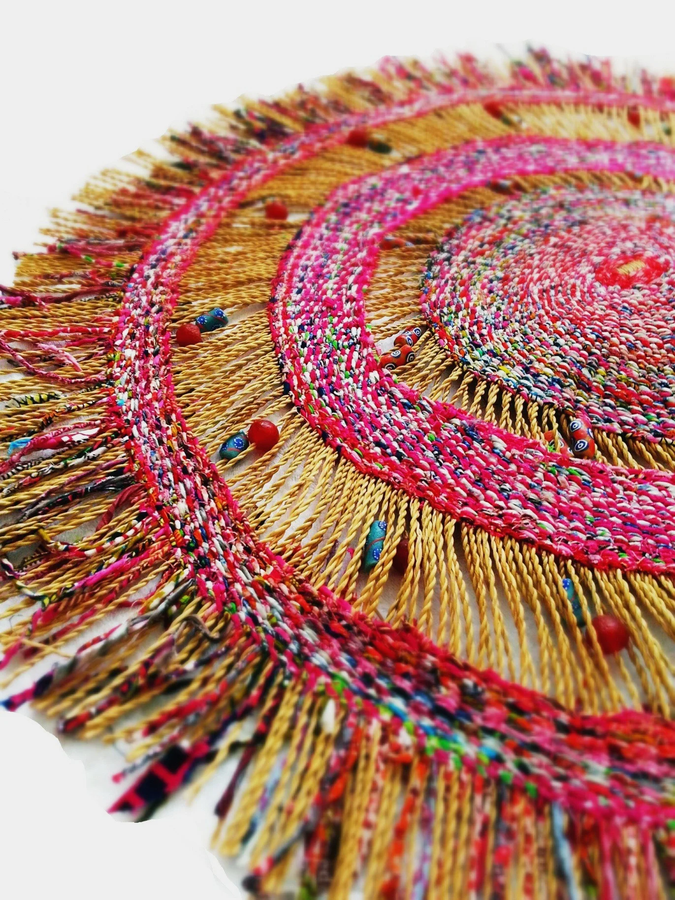 Detail of pink recycled cloth and plastic piece.jpg