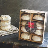 WHITE CHOCOLATE + GINGER PAVLOVA Pavlovas with white chocolate & sticky stem ginger. Serve with coconut cream and chocolate shards or crush onto ice cream.
