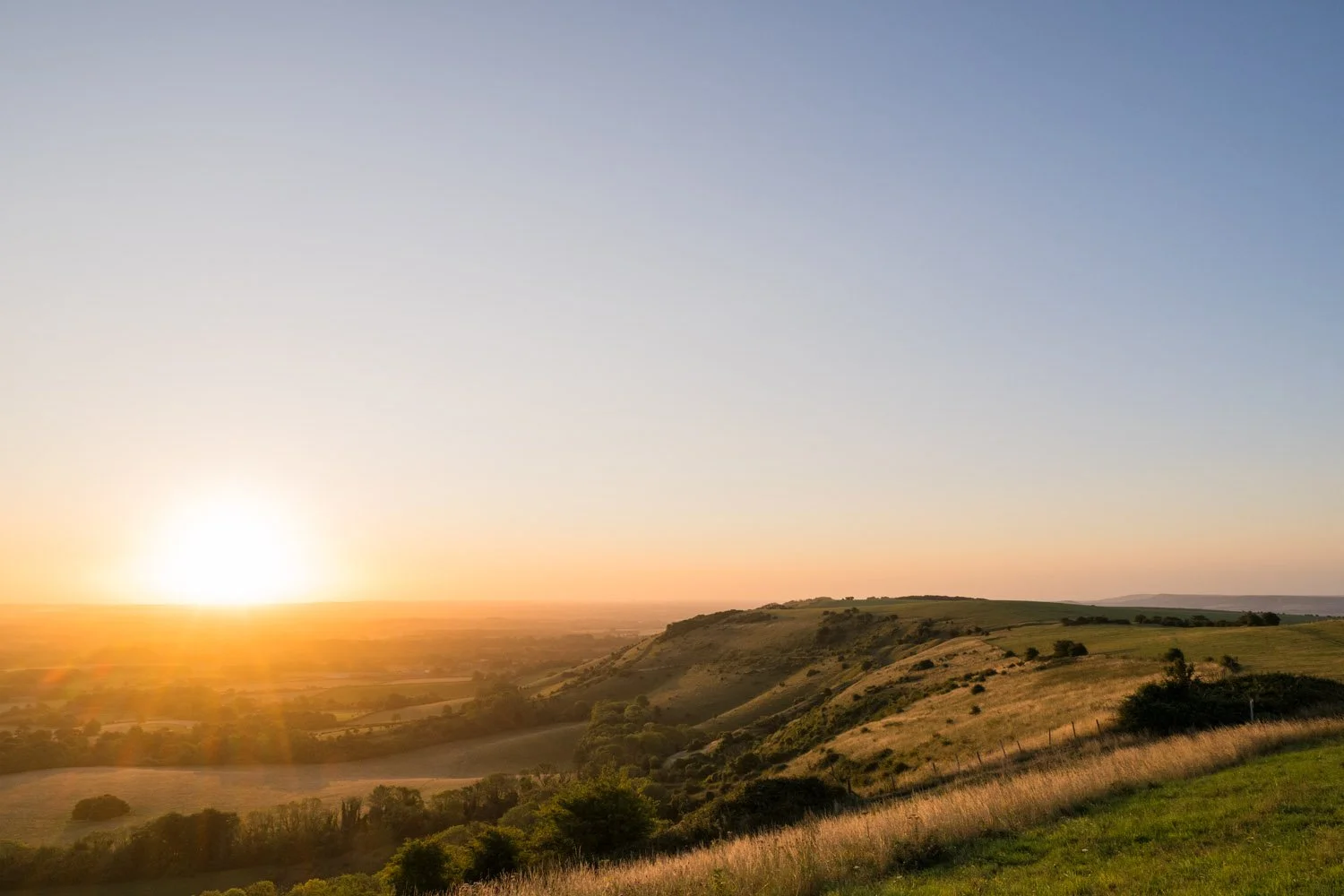 View east from Ditchling Beacon at sunrise, South Downs National Park, Sussex, England