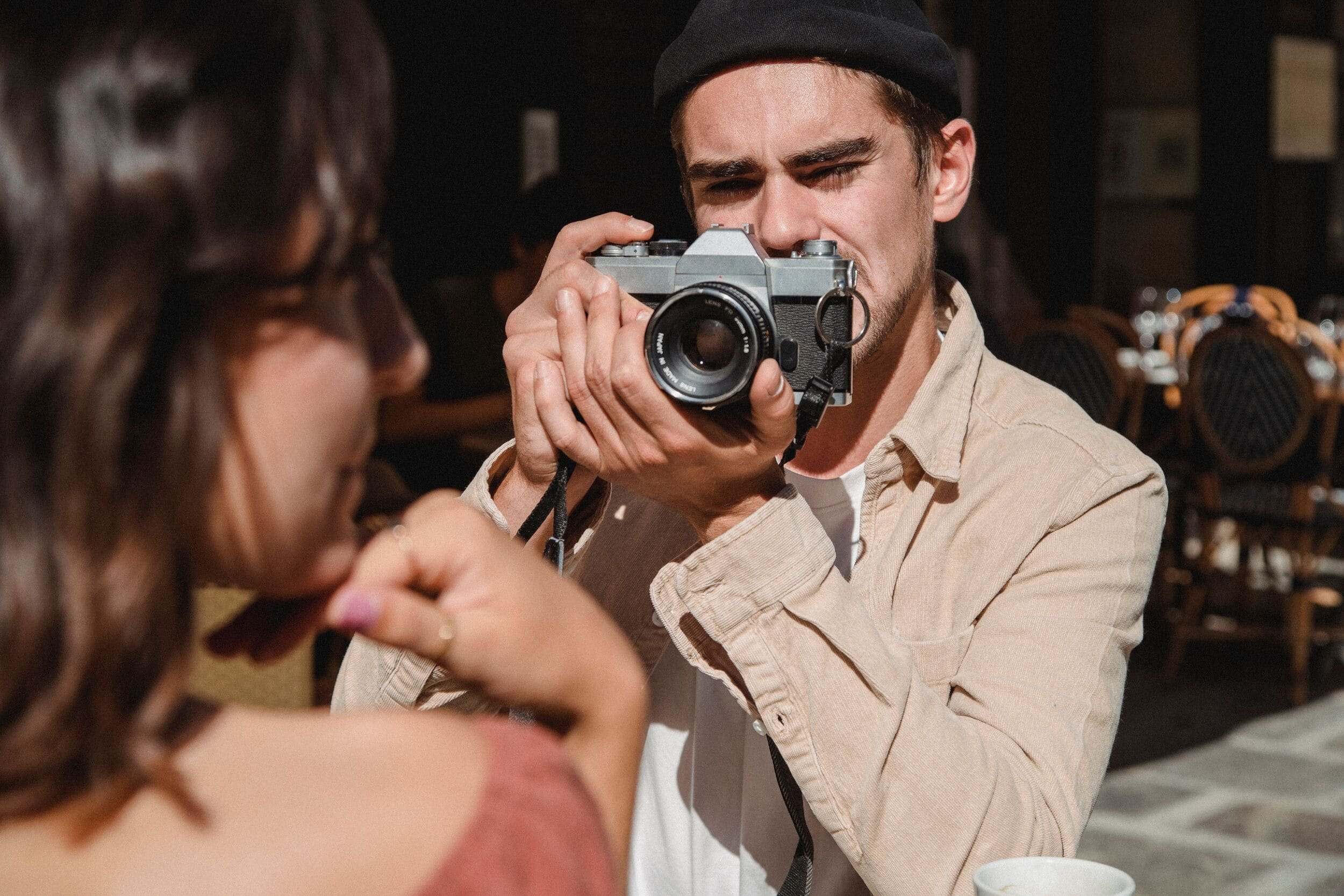 Photographer takes picture of woman