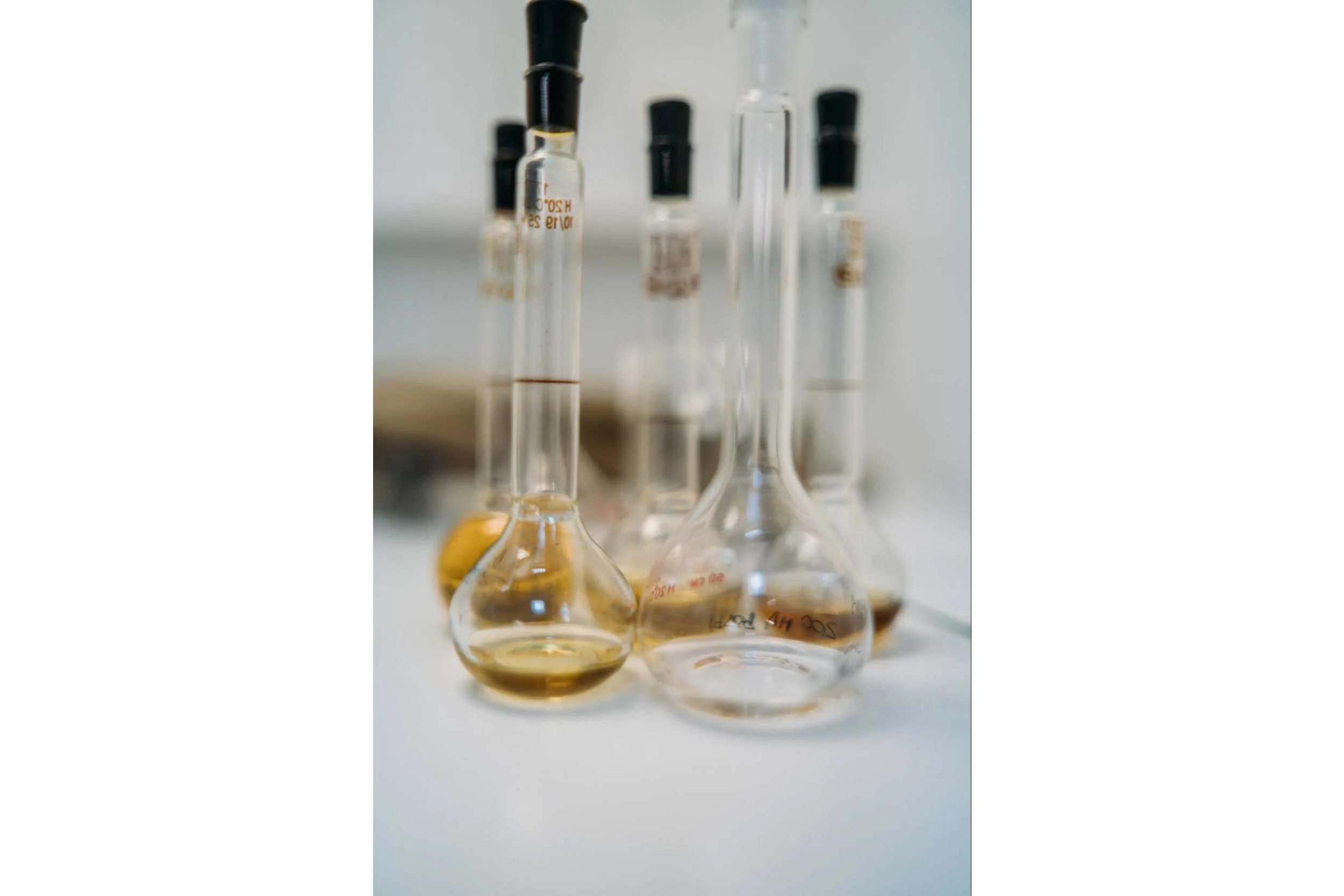 Group of lab vials on white desk