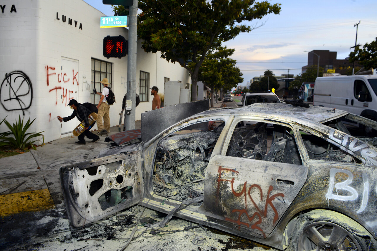  GEORGE FLOYD PROTESTS  A burned BMW destroyed during the protests in Santa Monica sits lifeless on a street corner while rioters graffiti building walls. 