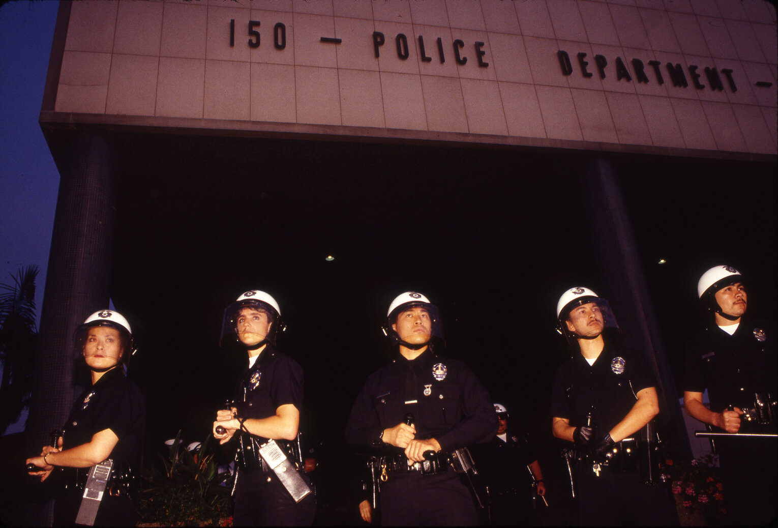  RODNEY KING RIOTS  Shortly after the rioting broke out in downtown LA, members of the LAPD form a line to protect their besieged headquarters, 1992 