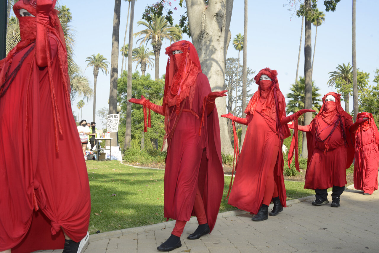  Extinction Rebellion’s Red Rebel Brigade activist troupe appears at “The Wrong Amazon is Burning” rally in Beverly Hills  at Will Rogers Memorial Park, 2020 