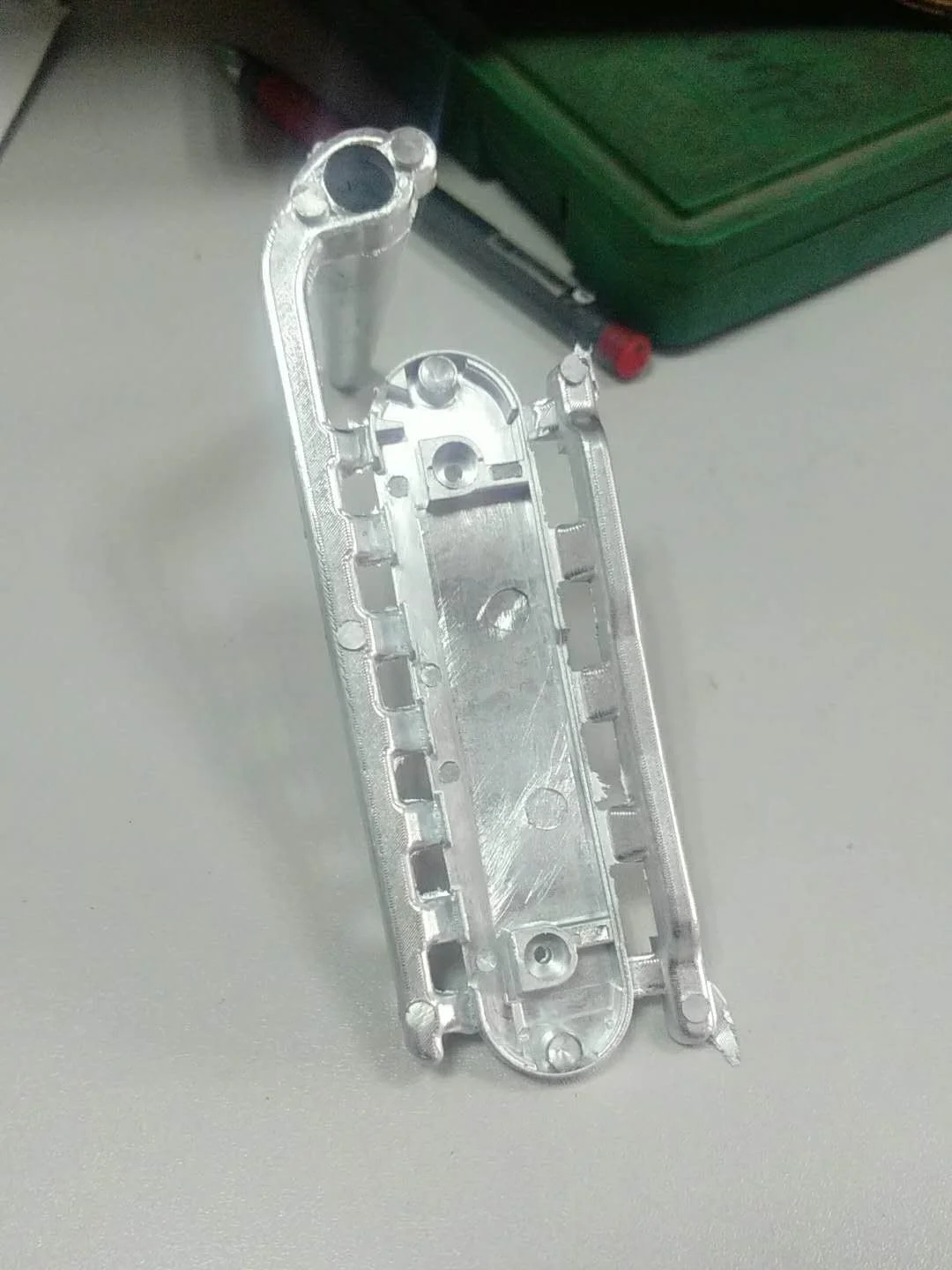 Here’s a die cast housing complete with sprue fresh out of the mould, waiting for post processing.