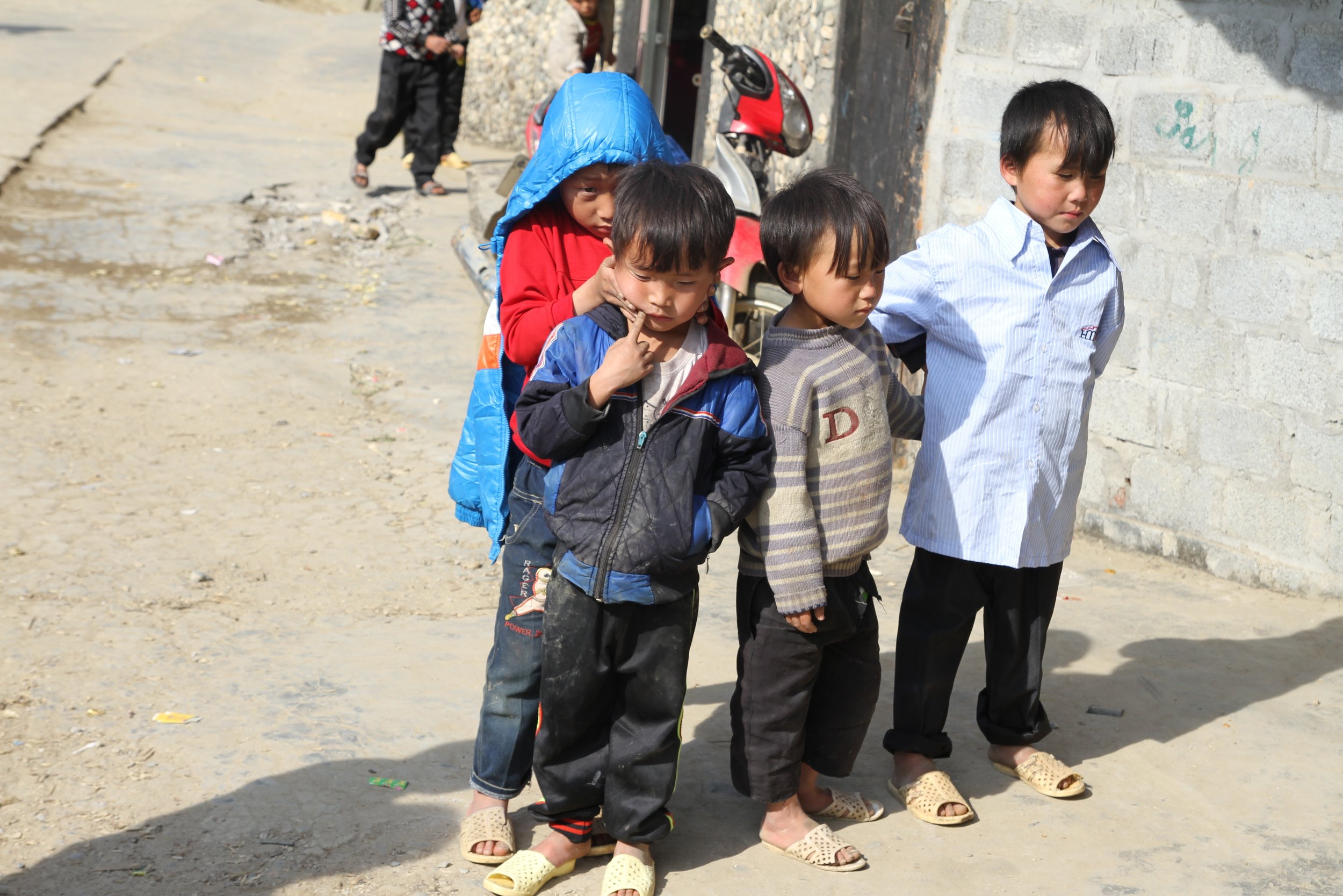 Kids in matching shoes hang out in SaPa