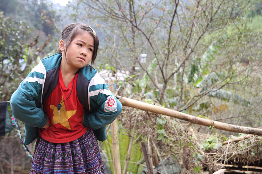 A girl wears a Communist T-shirt