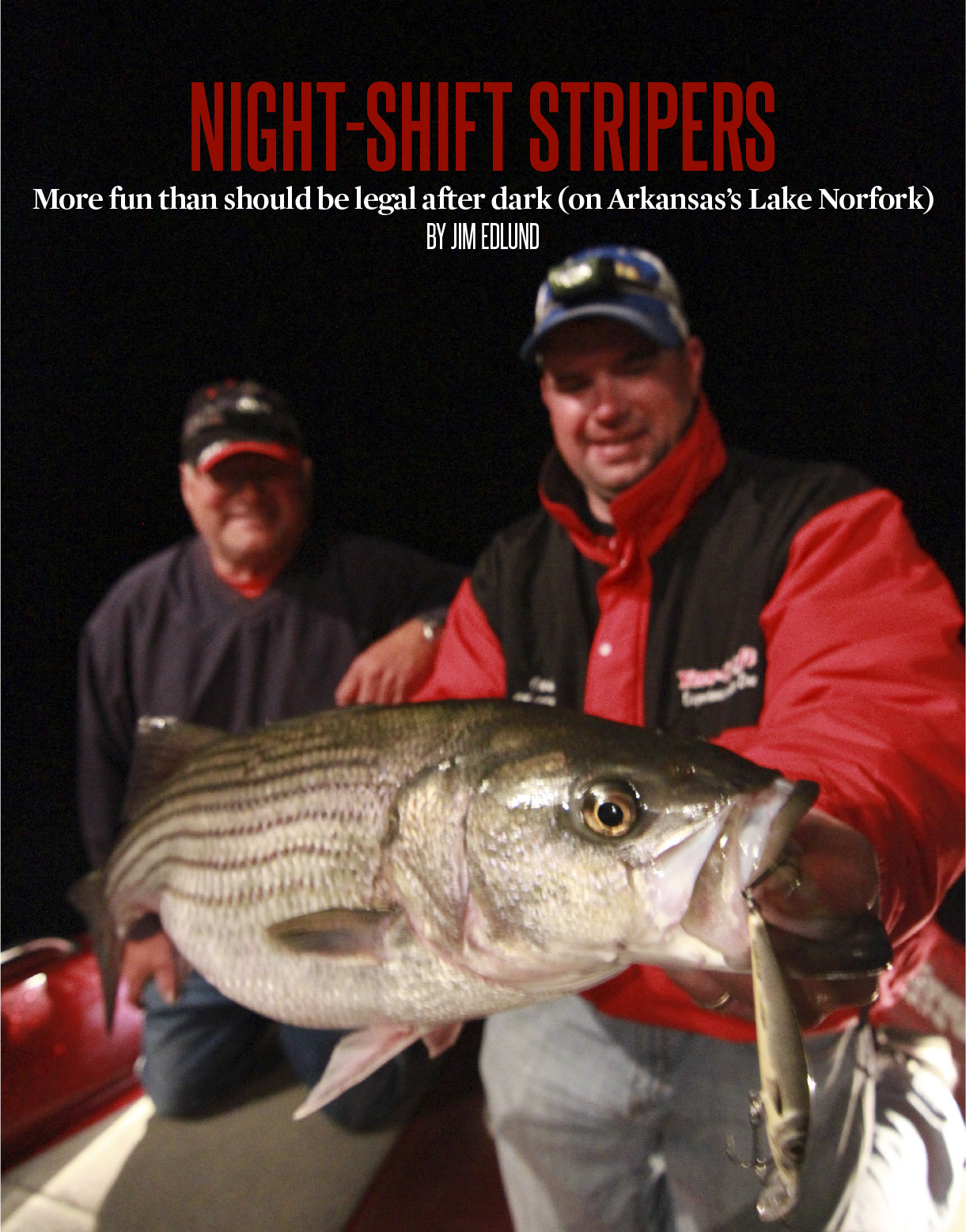 Larry Olson and Jason Mitchell with a Lake Norfork Striper.