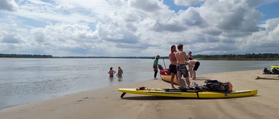 Paddlers cool off after tackling the mighty Mississippi River.