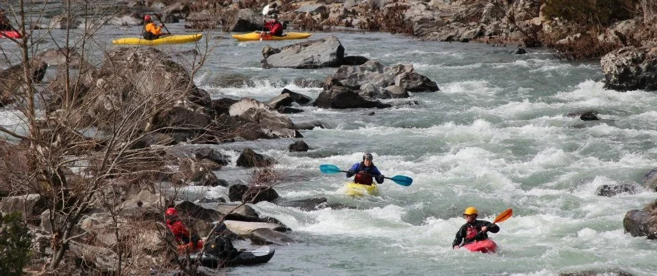Kayakers learn how to control their crafts before taking on more challenging whitewater.