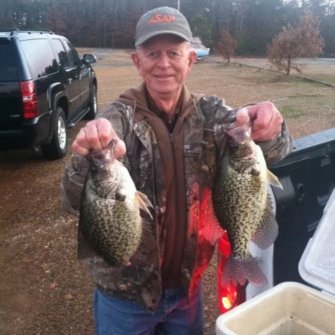 Mark’s buddy (and long-time Lake Maumelle fisherman) Johnny Lewis shows off a couple of nice crappie caught using Mark’s cold water fishing techniques.