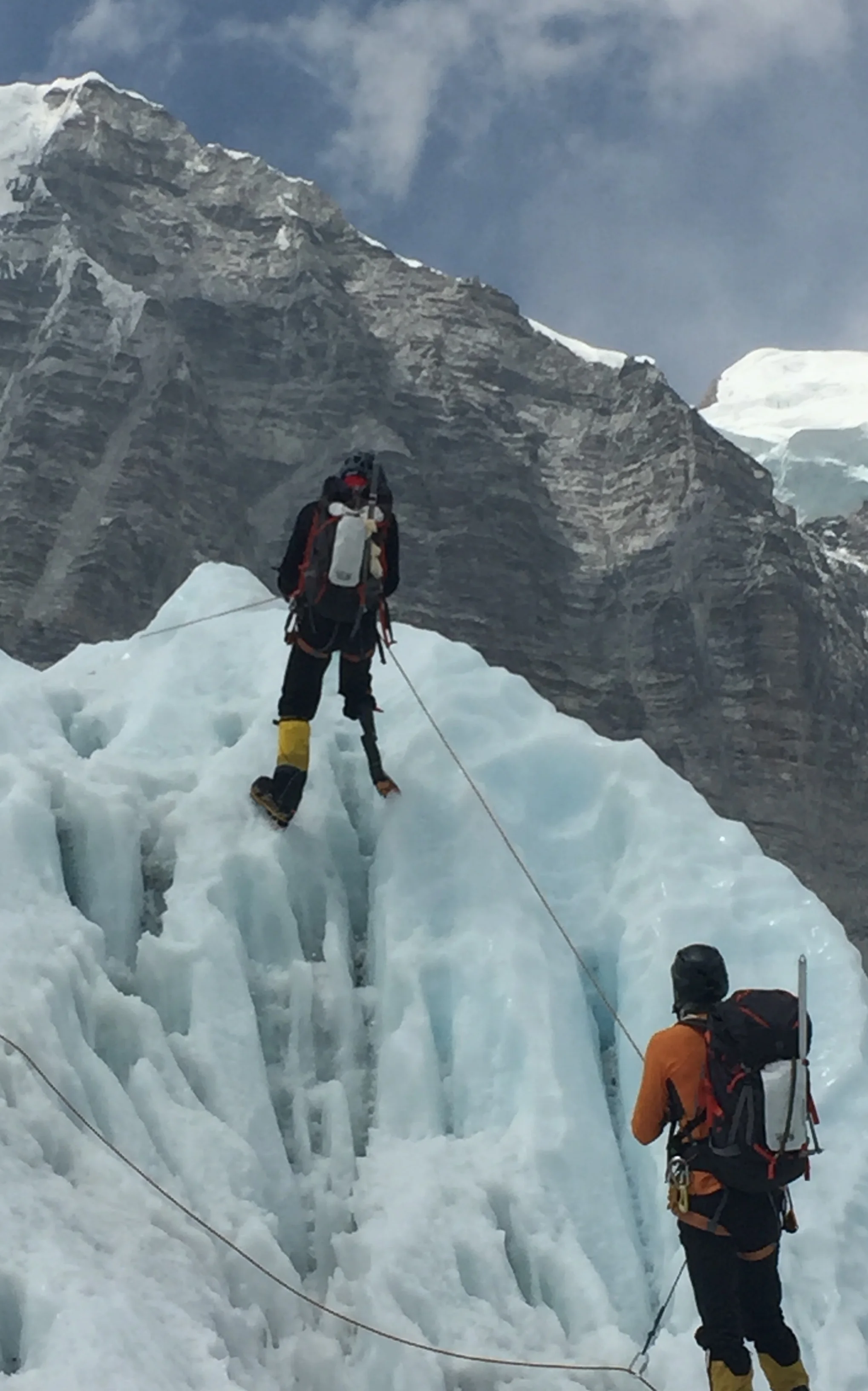Part of the preparation for climbing Everest involved obstacle courses in the Himalayan foothills (top). Dangerous ice floes and high altitude combined to create an enormous challenge for everyone on Jeff’s team. (Facing page) An exuberant team celebrates their ascent of the world’s tallest peak. Jeff (bottom) had to wear up to 20 pairs of socks to maintain the fit of his prosthetic leg after losing an enormous amount of weight on the climb. 