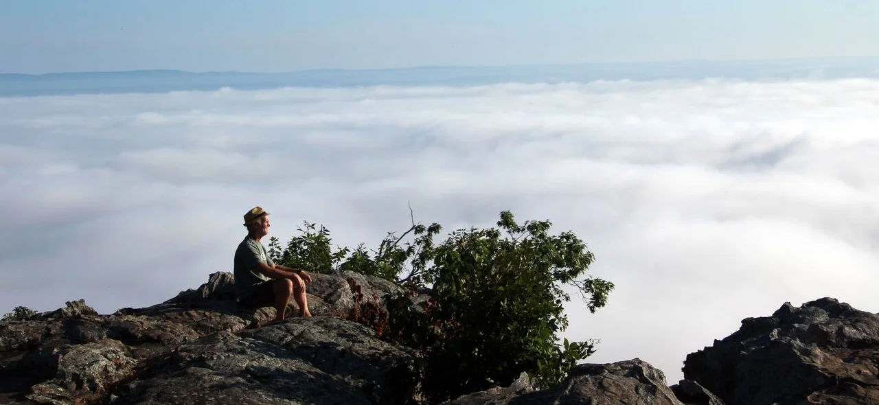 Bob Robinson takes a break from driving and looks out over the River Valley after arriving at Petit Jean Mountain State Park in Morrilton.