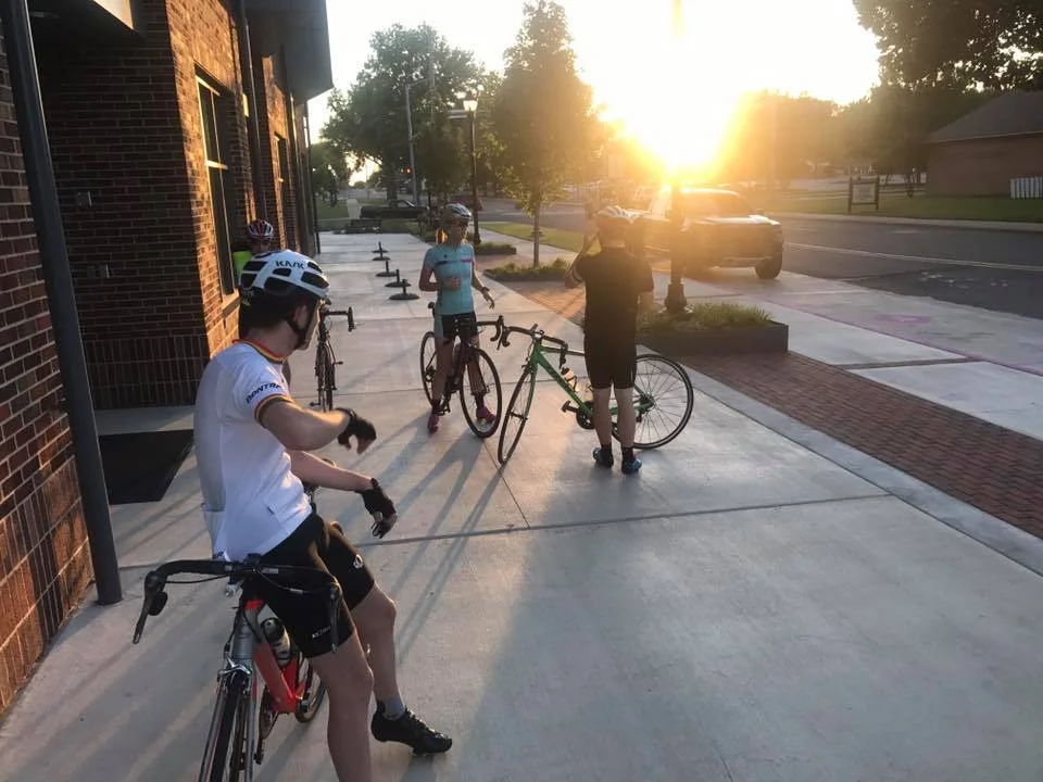 University of Central Arkansas students gather outside the newly built Donaghey Hall for a sunset bike ride.