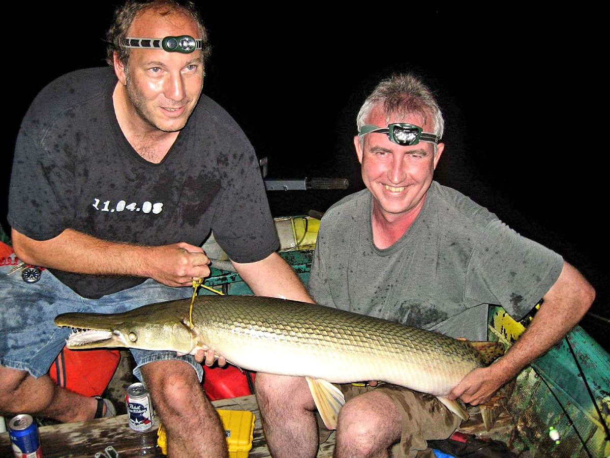 Author Mark “Hollywood” Spitzer, left, shows off a prize specimen with fishing partner Ben “Minnow Bucket” Damgaard. 