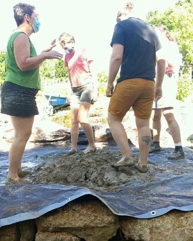 Mixing the cob for building our cob oven. Cob is made up of clay, sand, straw, and water, and the easiest way to mix it is with your feet! Lots of volunteers came to help, and so did our director Susan! 
#coboven #naturalbuilding #regenerativeagriculture #regenerativefarming #regenerativefarm #regenerativelandmanagement