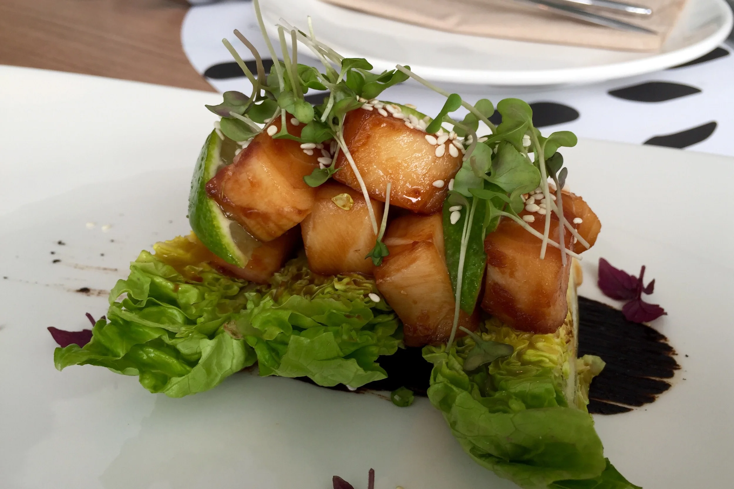 Butterfish with teriyaki, black garlic, baby lettuce, and apple kimchi 