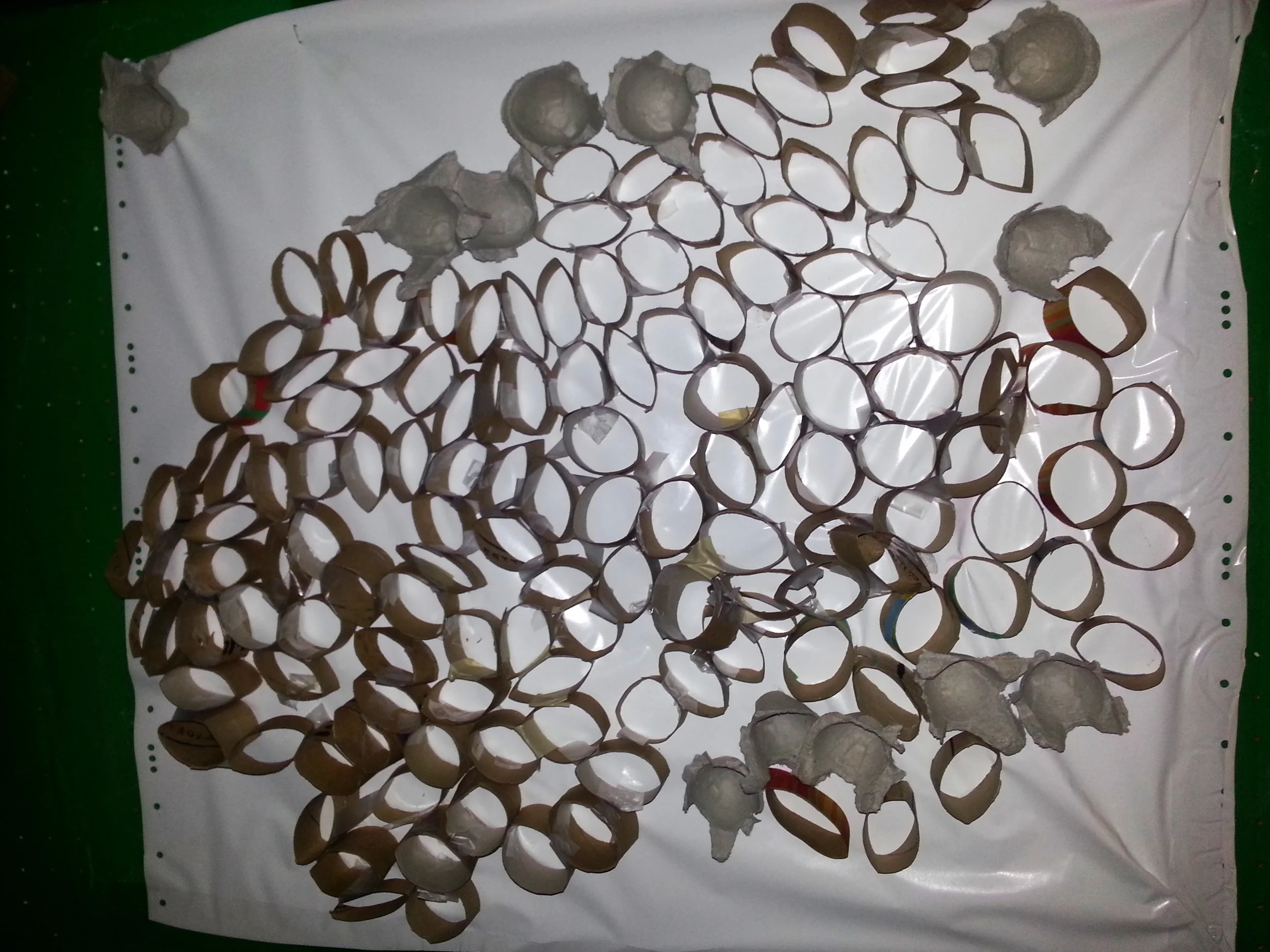 Preschoolers used contact paper and cut up tubes to construct a bees' nest during a study of bees. 