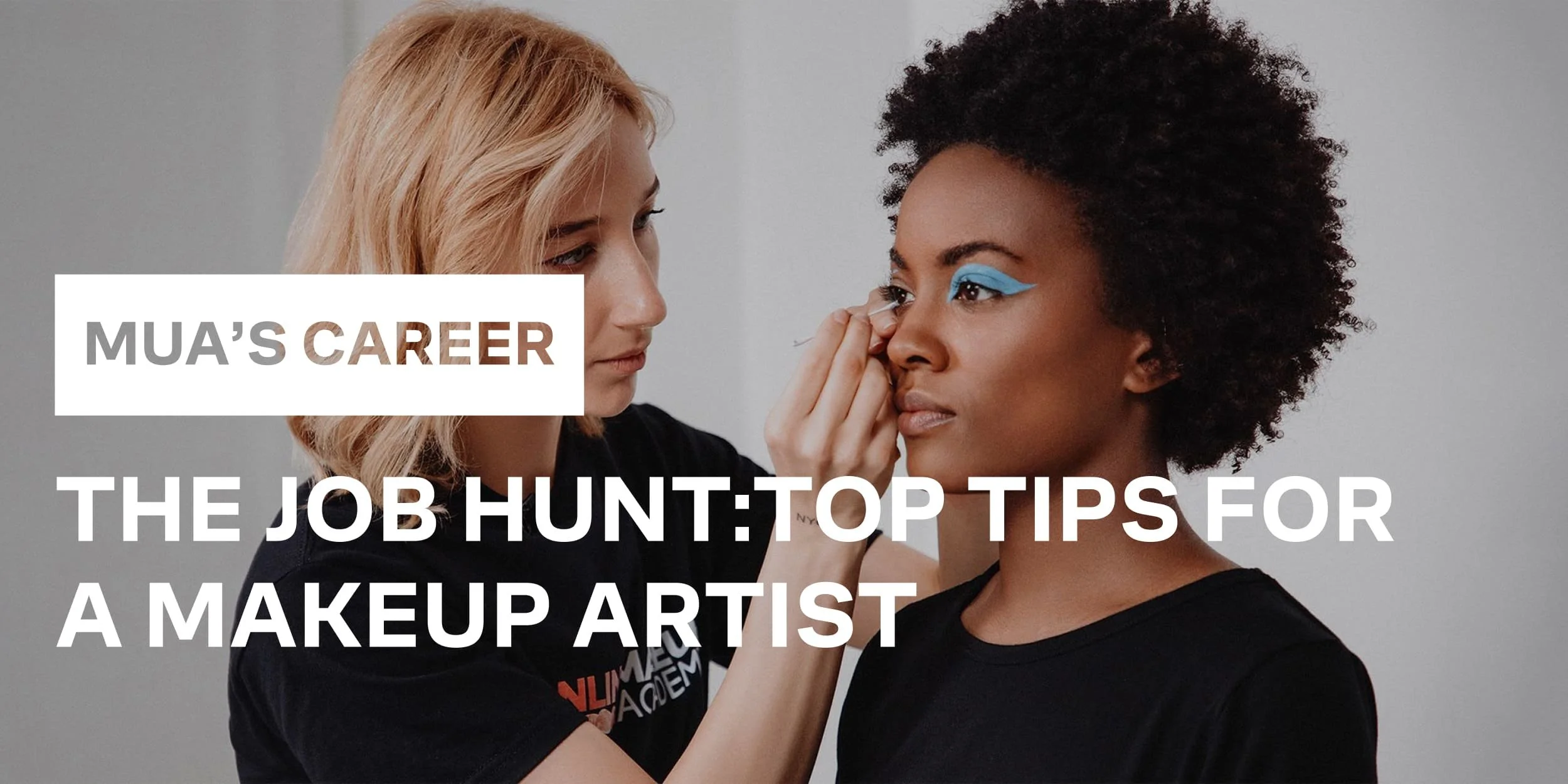 A makeup artist applies mascara on a model
