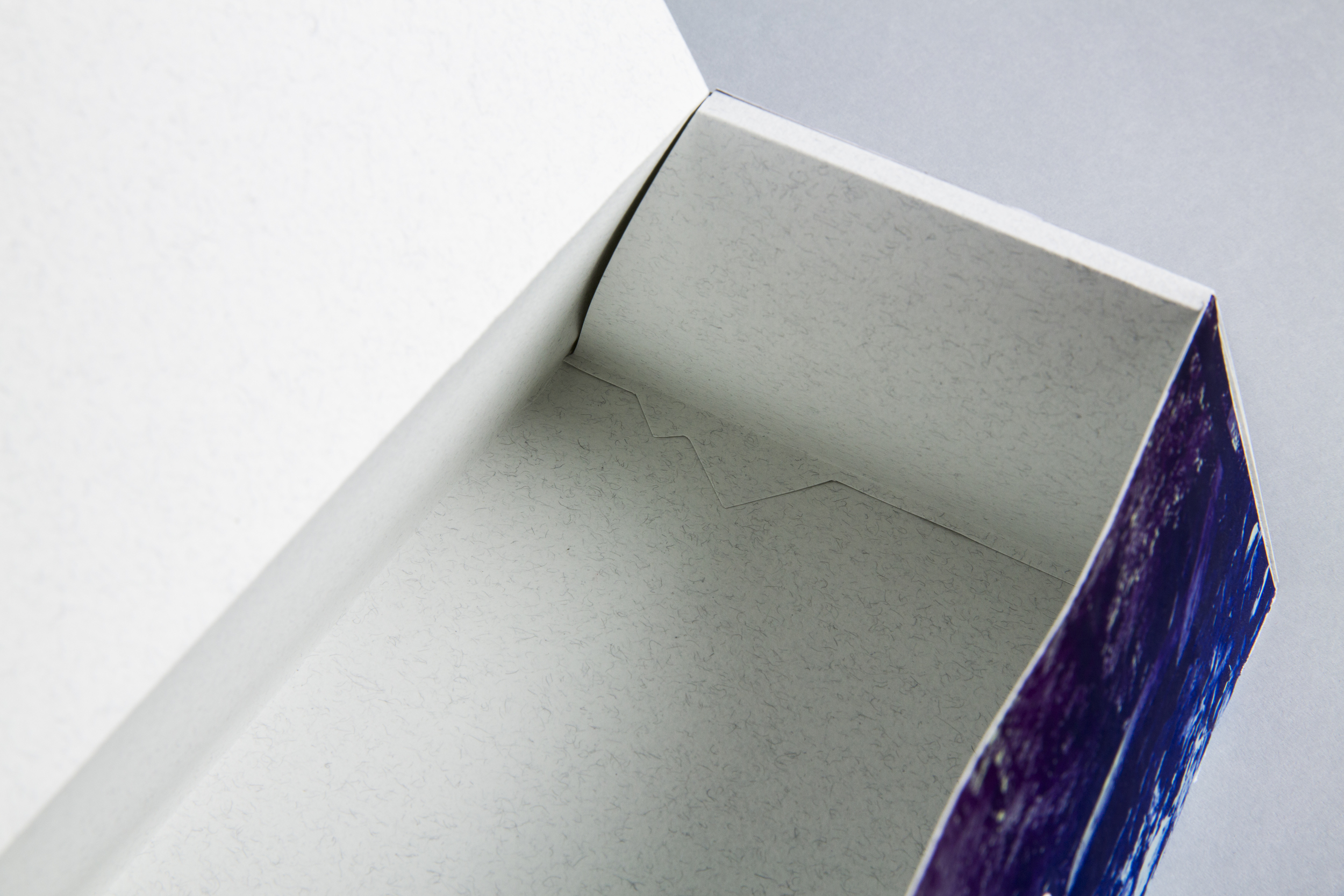 Deconstructed logo locking mechanism in bottom of box