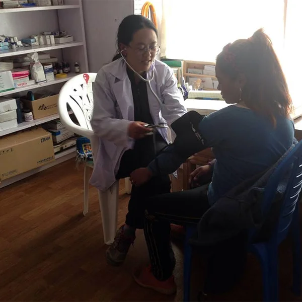 Nurse providing care to Nepali local. Tsering's fund sponsors health and dental care in rural Nepal.  Tsering's Fund supports healthcare in regions we operate in.