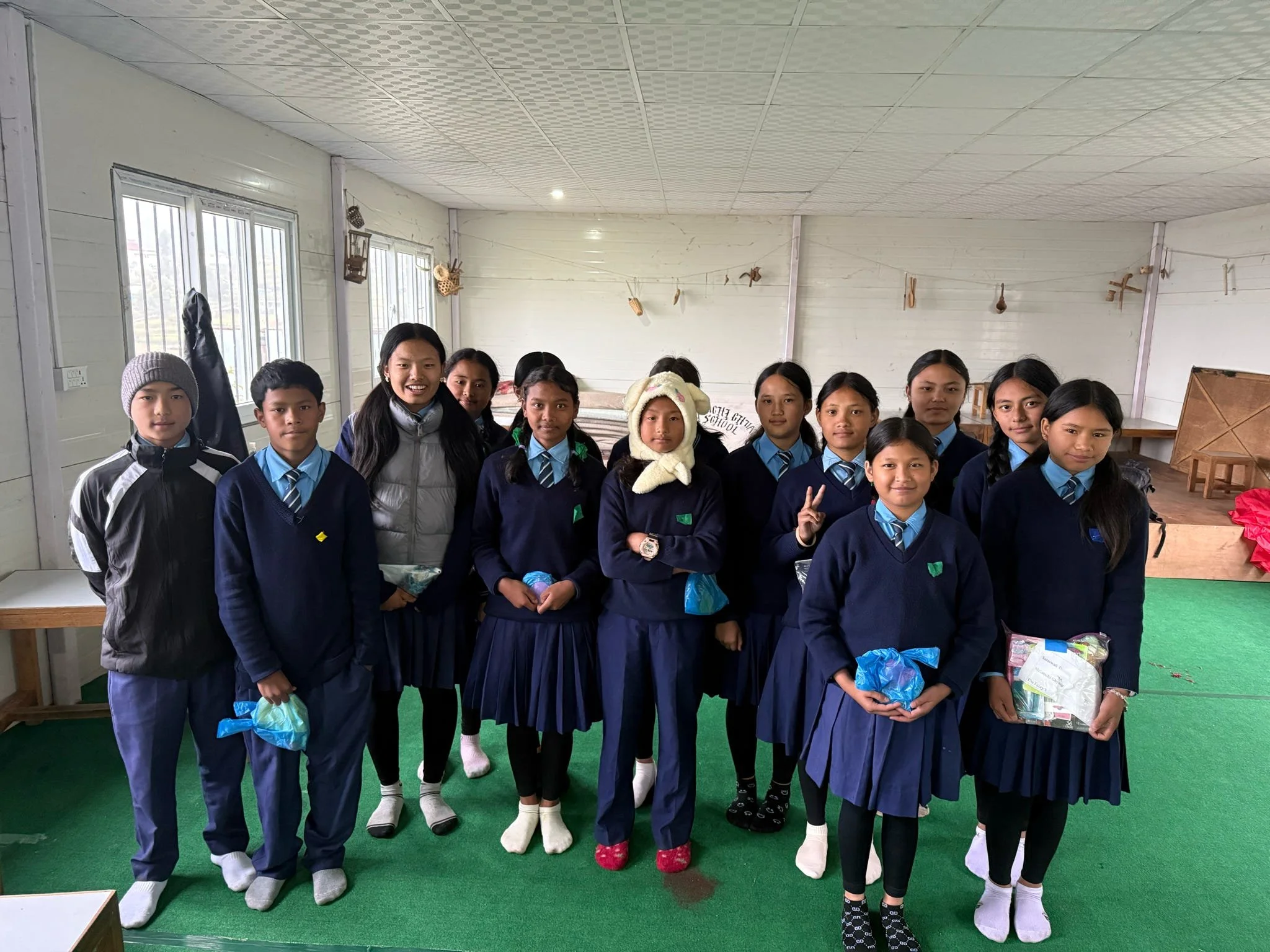 Nepali students at Melamchi Ghyang school in Nepal receiving gifts from Tsering's Fund