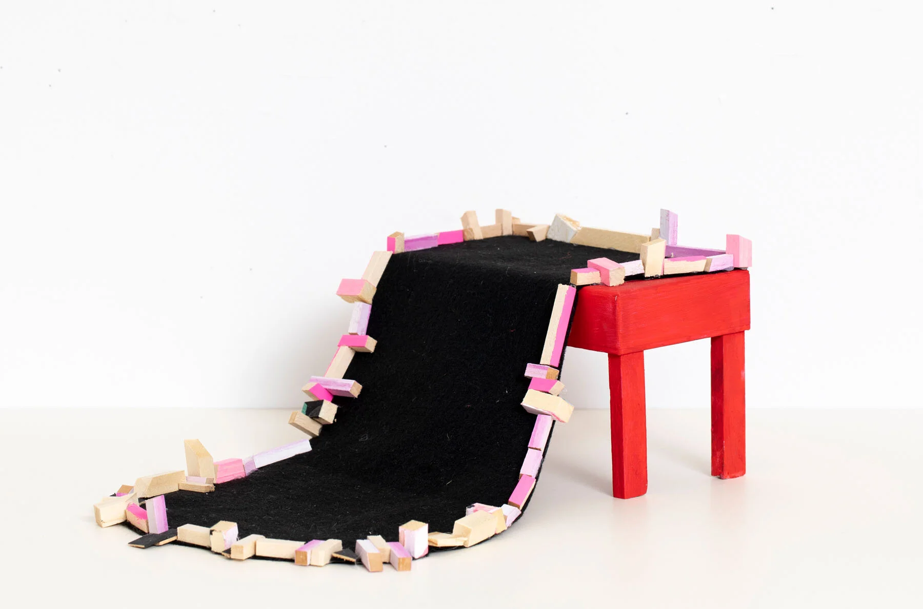   Spill Over , 2020  Felt, basswood, acrylic paint, cardboard, adhesive, 5” x 7” x 12” 