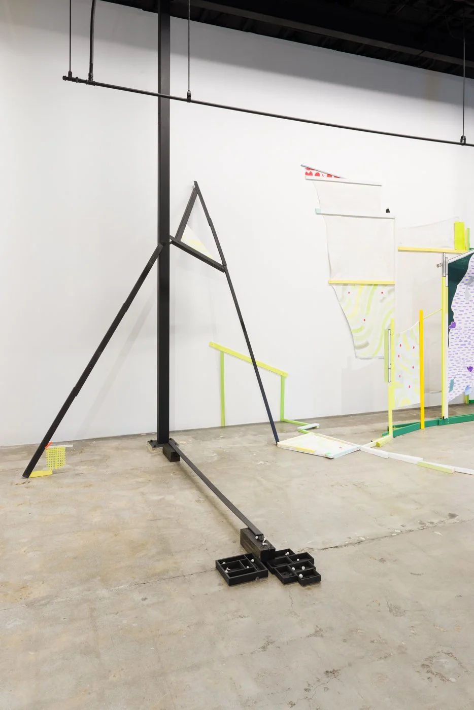   Coming Together, Falling Apart (detail) | 2022   Lumber, cardboard shipping corners, hardware, canvas, house paint, acrylic paint, foam core, MDF, sculpey, ceramic, scrap wood, futon frame slats, wood shims, existing steel beams of gallery. 