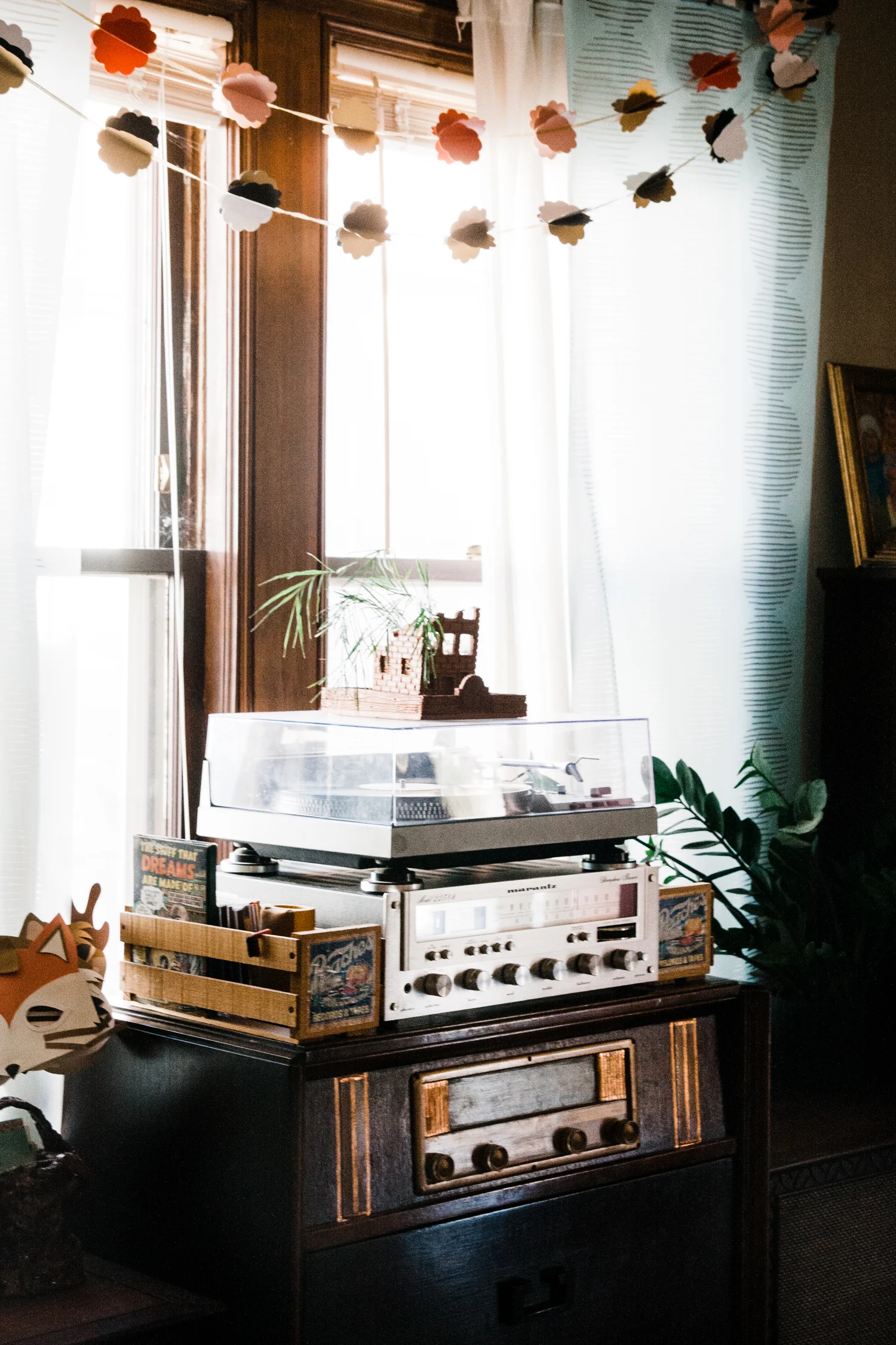 Allison made the crumbling building planter that sits atop the record player.