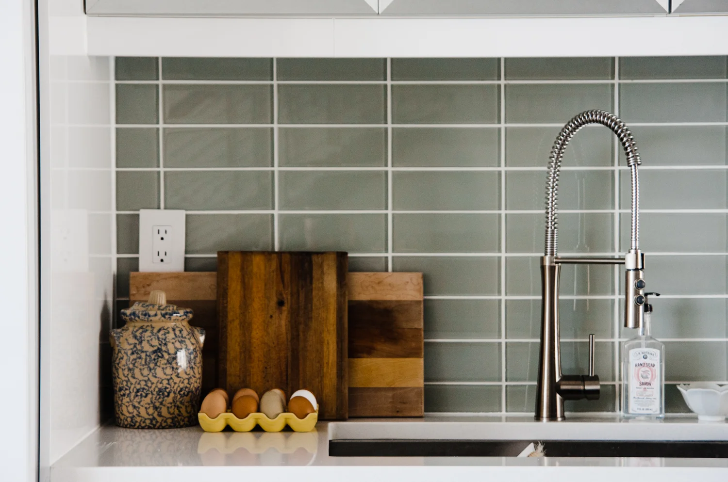 Hannah integrates vintage finds like this ceramic container throughout the space. It's a nice contrast to the newness of the home.