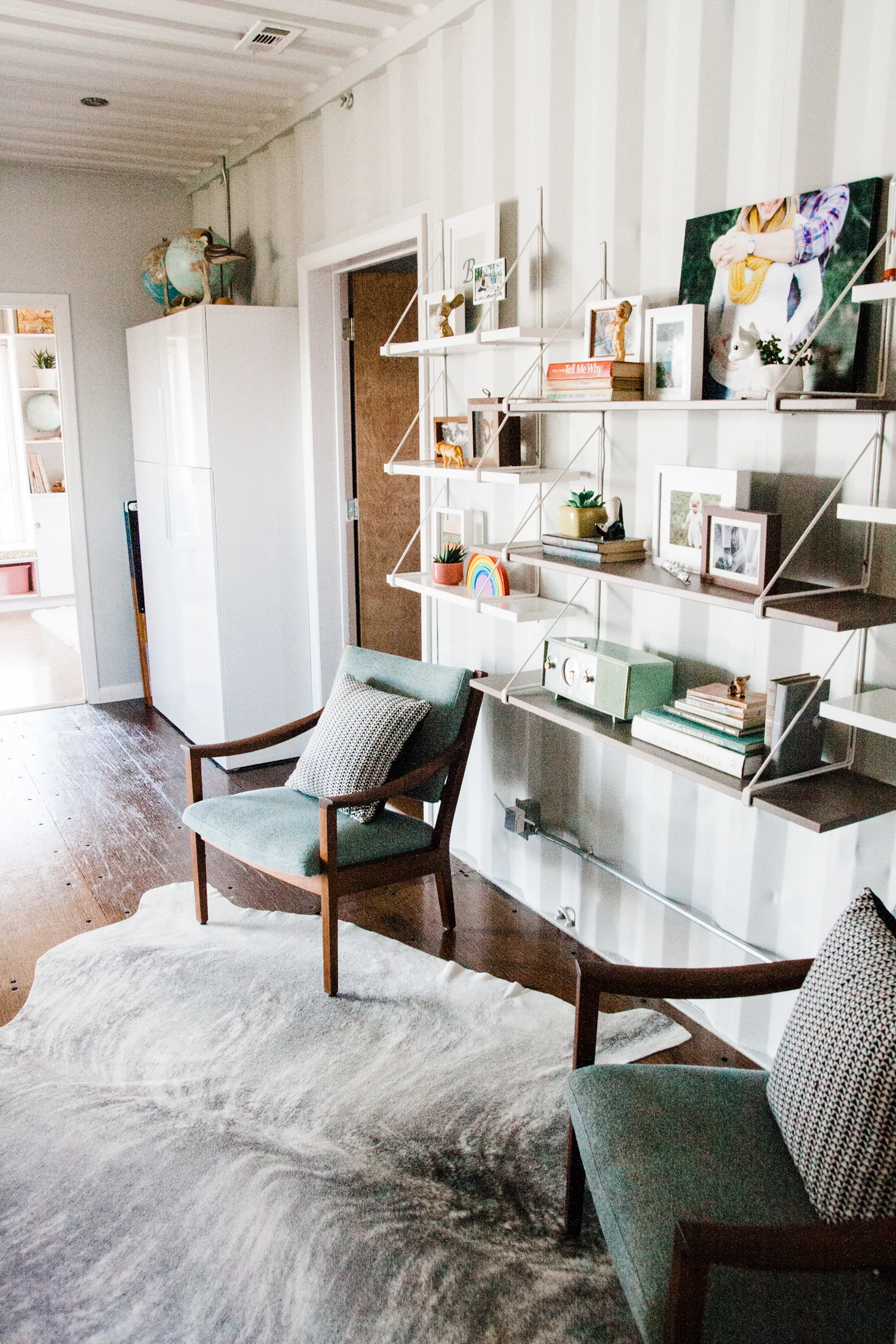 A lounging/music-listening area connects the girls' rooms.