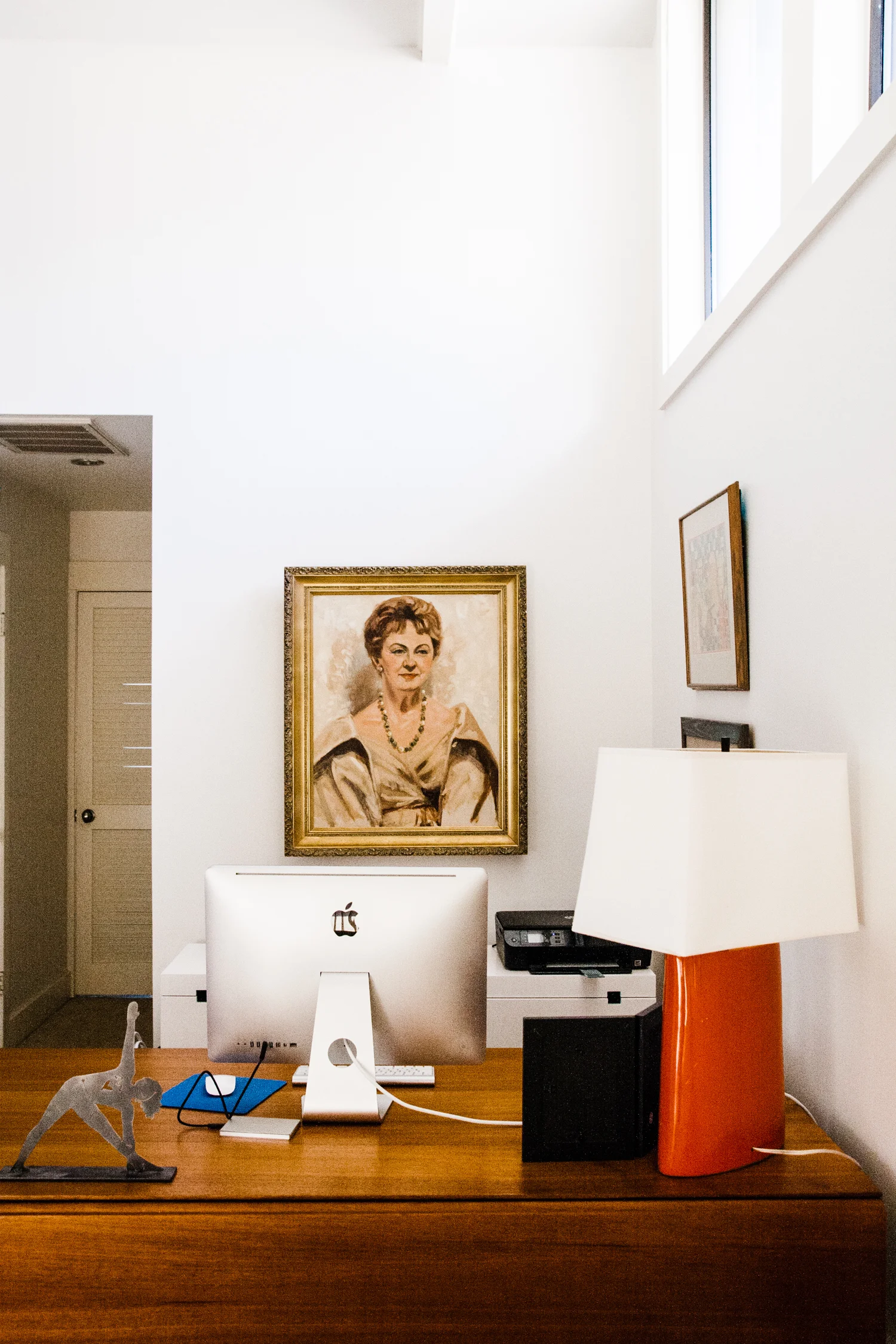 We chose to hang a portrait of her grandmother (grandma, right?) behind Annie's desk in a prominent position. Grandma is also facing the portrait of baby Annie that is nestled on the small wall to the left of the sliding glass doors (pictured above).
