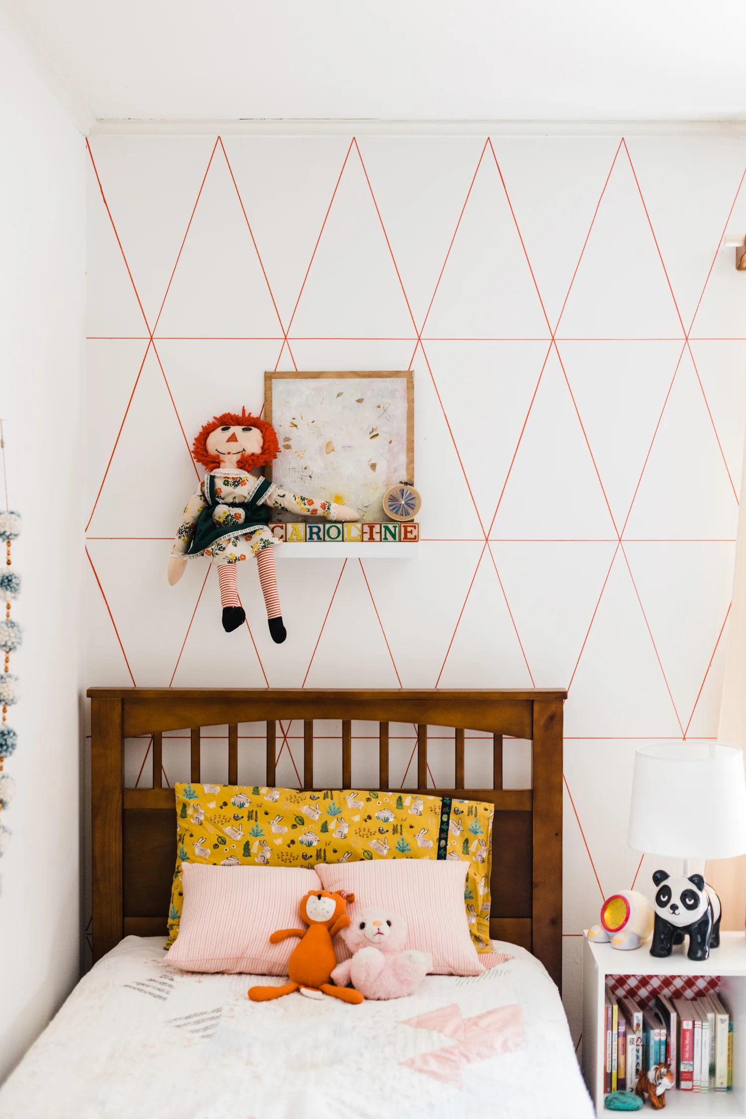 Bianca from Owl & Drum created two small throw pillows for Caroline's new big girl bed using THE PRETTIEST neon pink striped fabric. Holy cow! I'm so happy I had a reason to have this fabric in my life.