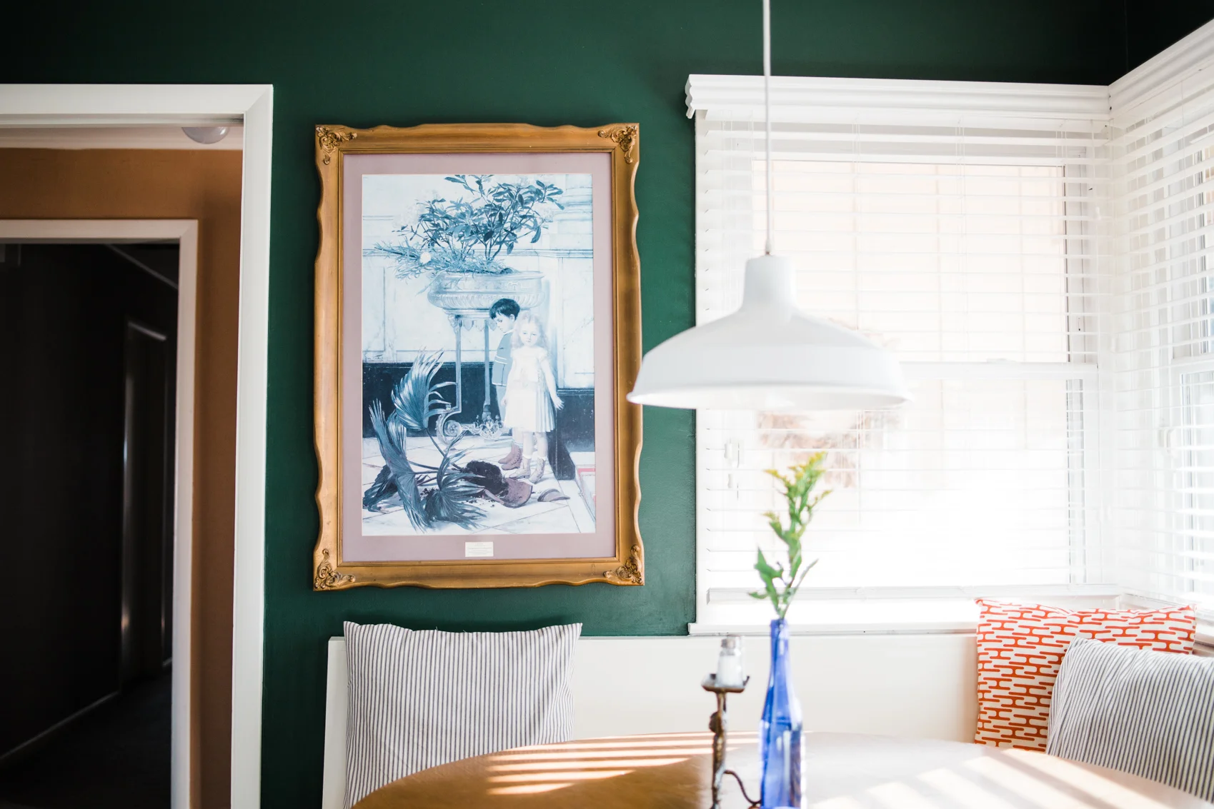 After: The banquette efficiently uses every square foot of the nook AND can seat more than the tiny table. Plus, I love how we are nestled in between two big windows.