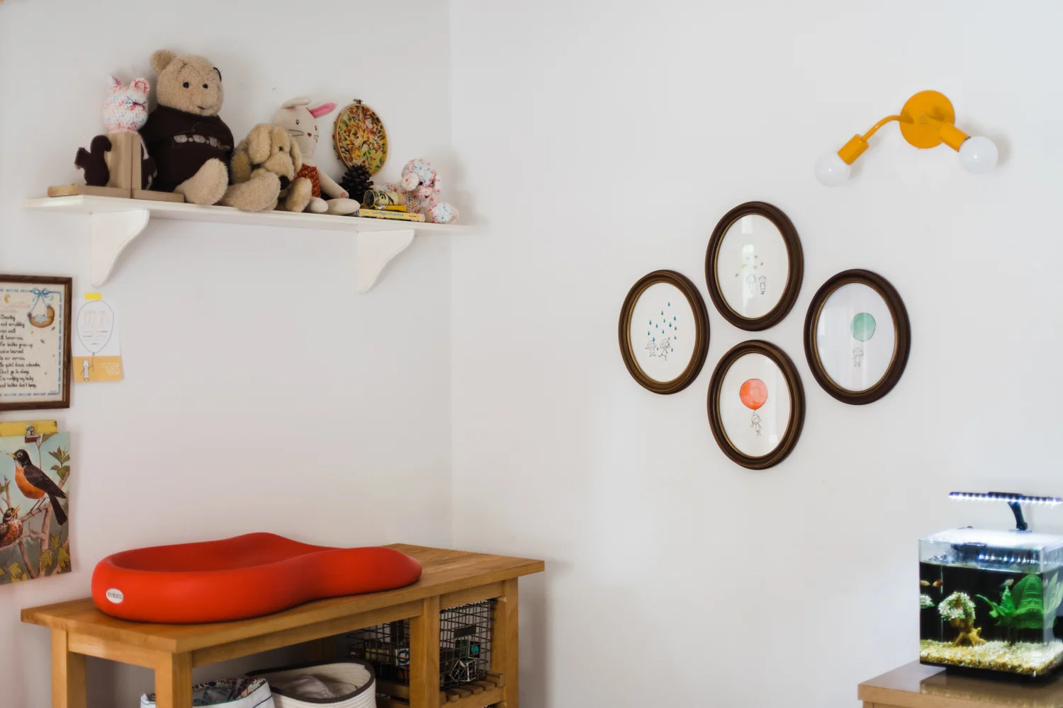 Palmer has a similar look in her shared kids' room . Simple dark wooden frames in various shapes are found here.