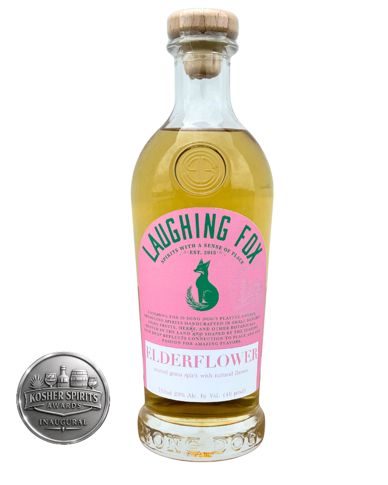 A bottle of Laughing Fox Elderflower spirit with a pink label and cork stopper, alongside a Kosher Spirits Awards medal.