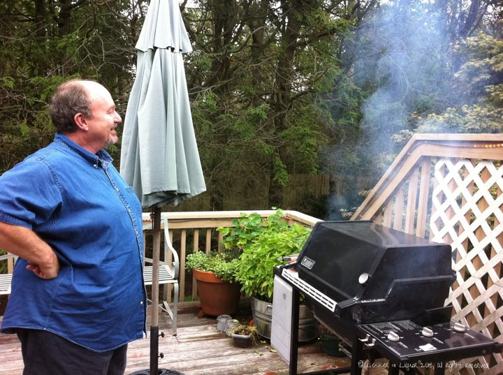 Harry surveying his backyard kingdom and charring off the Weber in preparation for that evening's braai; he and Carolyn have since moved across the country and I miss them terribly.