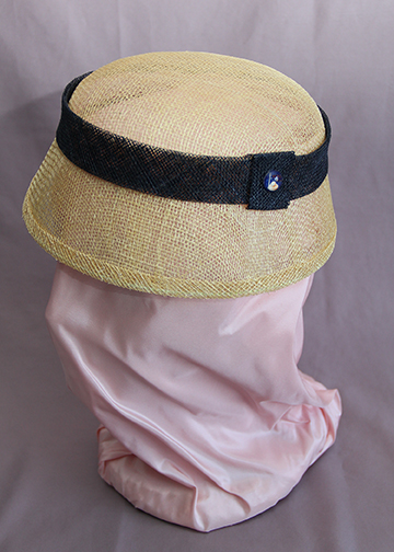 Natural sinamay hat with navy sinamay trim and vintage 1939 New York World's Fair glass button