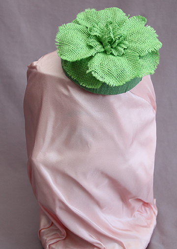Small pillbox in green linen with NYC-made green flower