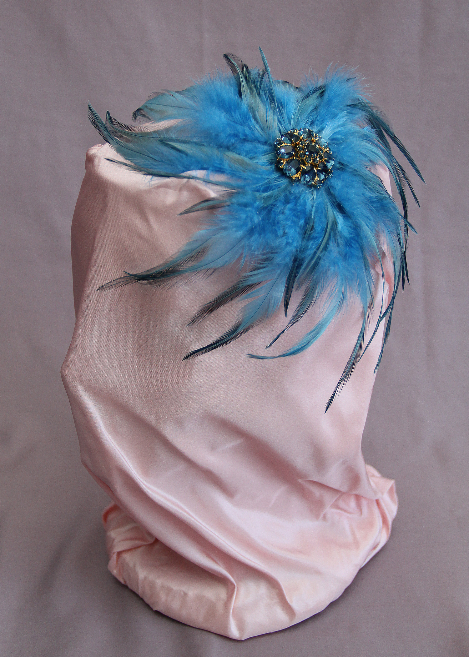 Blue (with black) feather fascinator with dark blue Swarovski crystal center