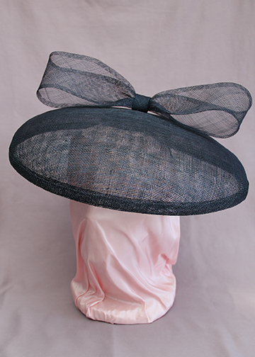 Vintage-style wide brim hat in navy sinamay with large bow