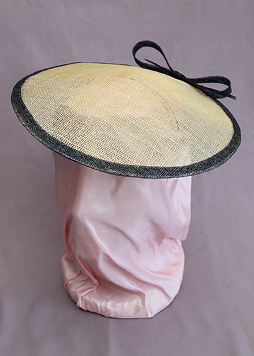 Natural sinamay conical (or "coolie") hat with navy sinamay trim and back bow
