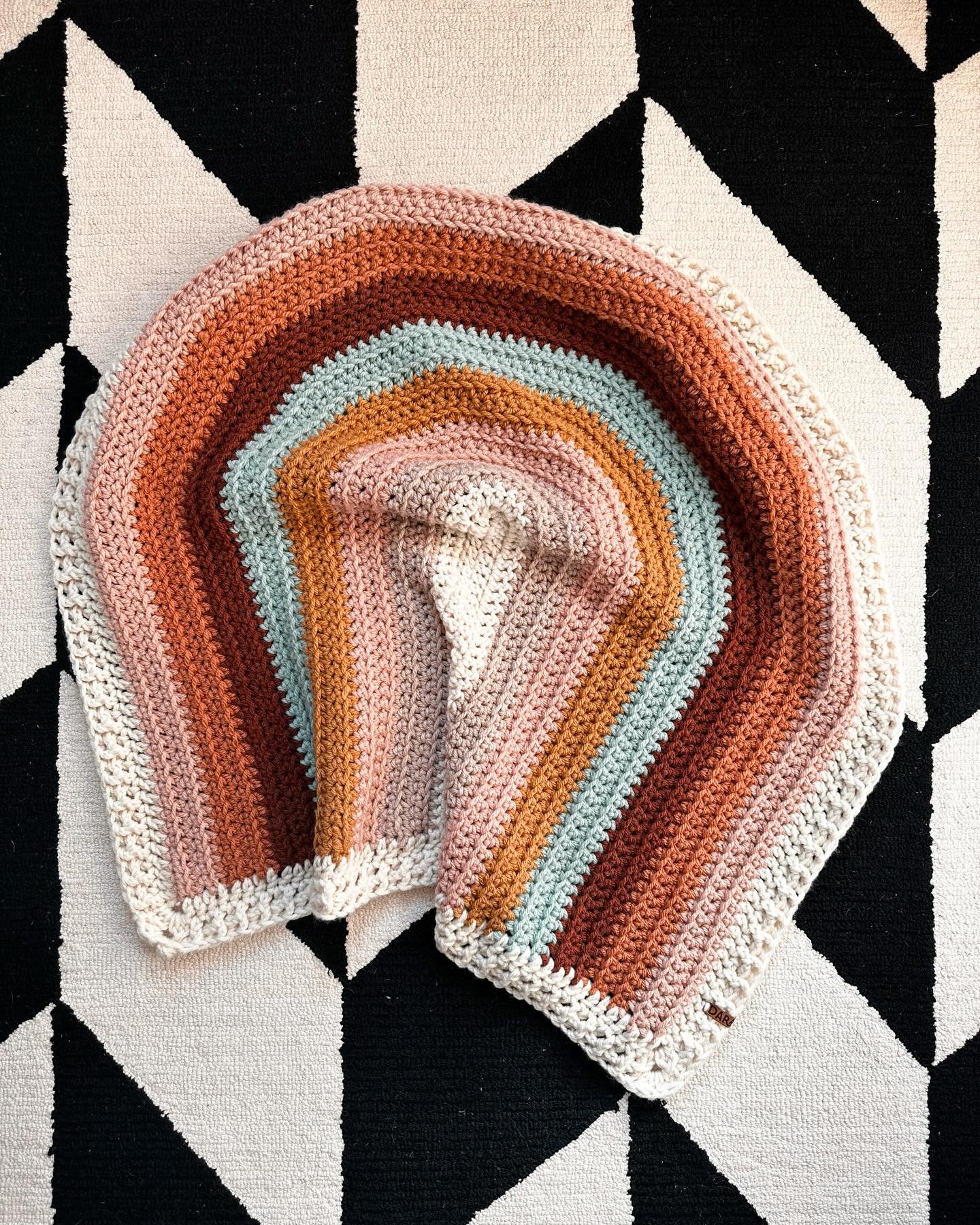 We&rsquo;re deep into blanket weather and this is my favorite rainbow to warm up the day! 🧡

Pattern: @mamamademinis 
Yarn: @lionbrandyarn Hue &amp; Me

#crochetblanket #handmadeblanket #babyblanket #rainbowblanket #crochetrainbow #handmadeforthehom