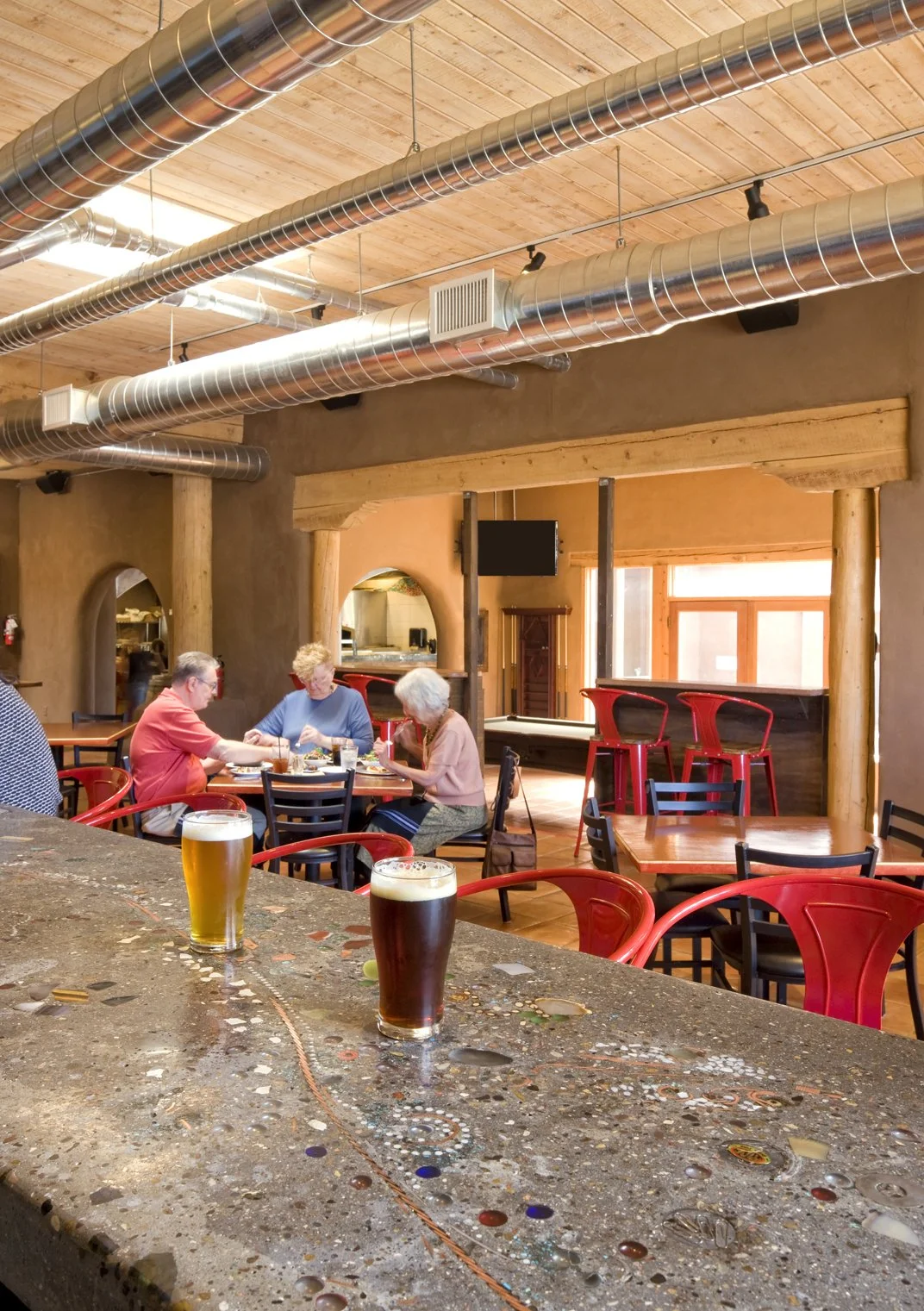  Cast concrete countertop abounds with recycled treasures 