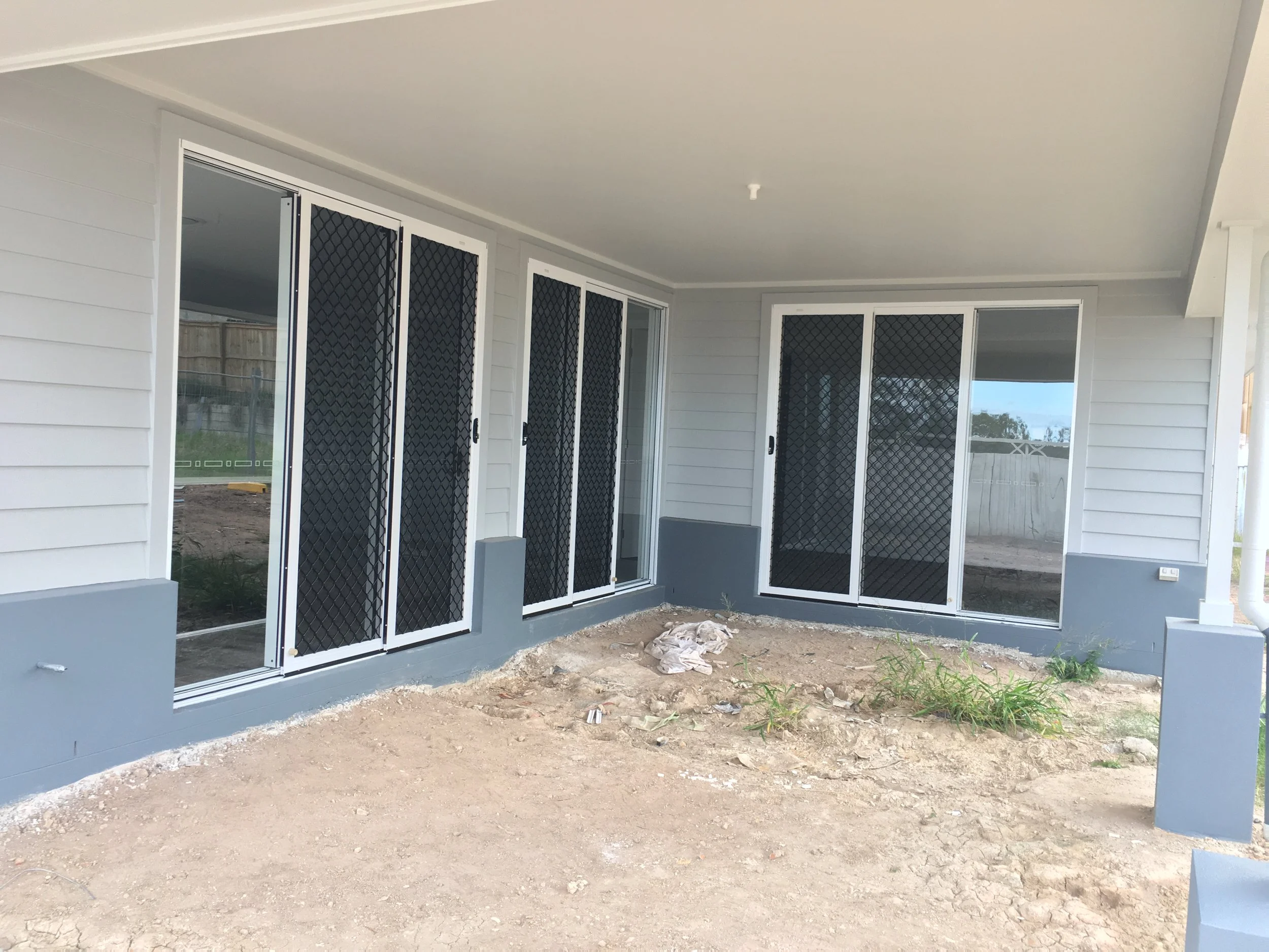 3BarrierDoorsOXXBlackGrillWhiteFrame.JPG