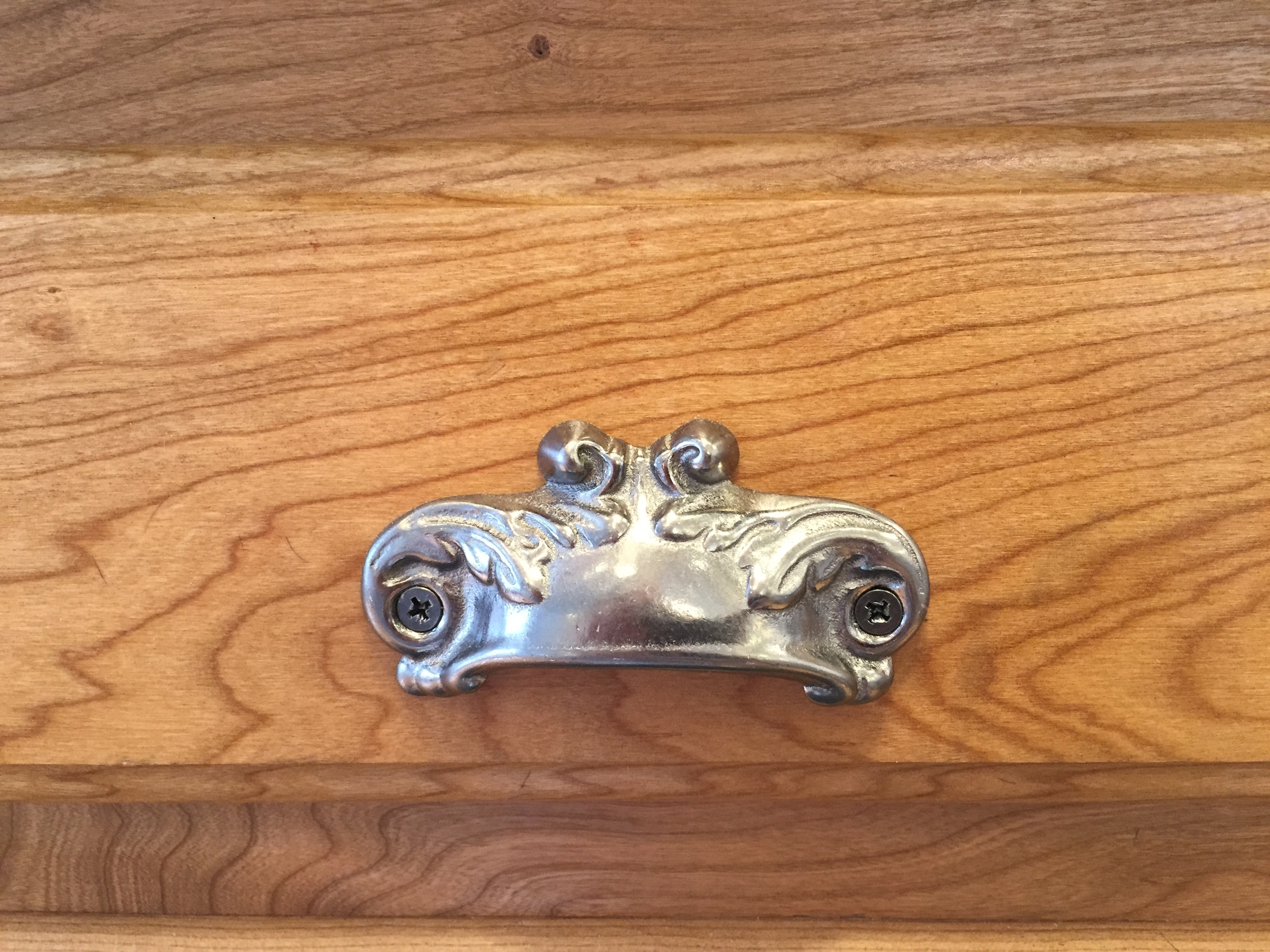 Cast Iron Pulls on custom cherry wood cabinets with a Vermont Soapstone top.