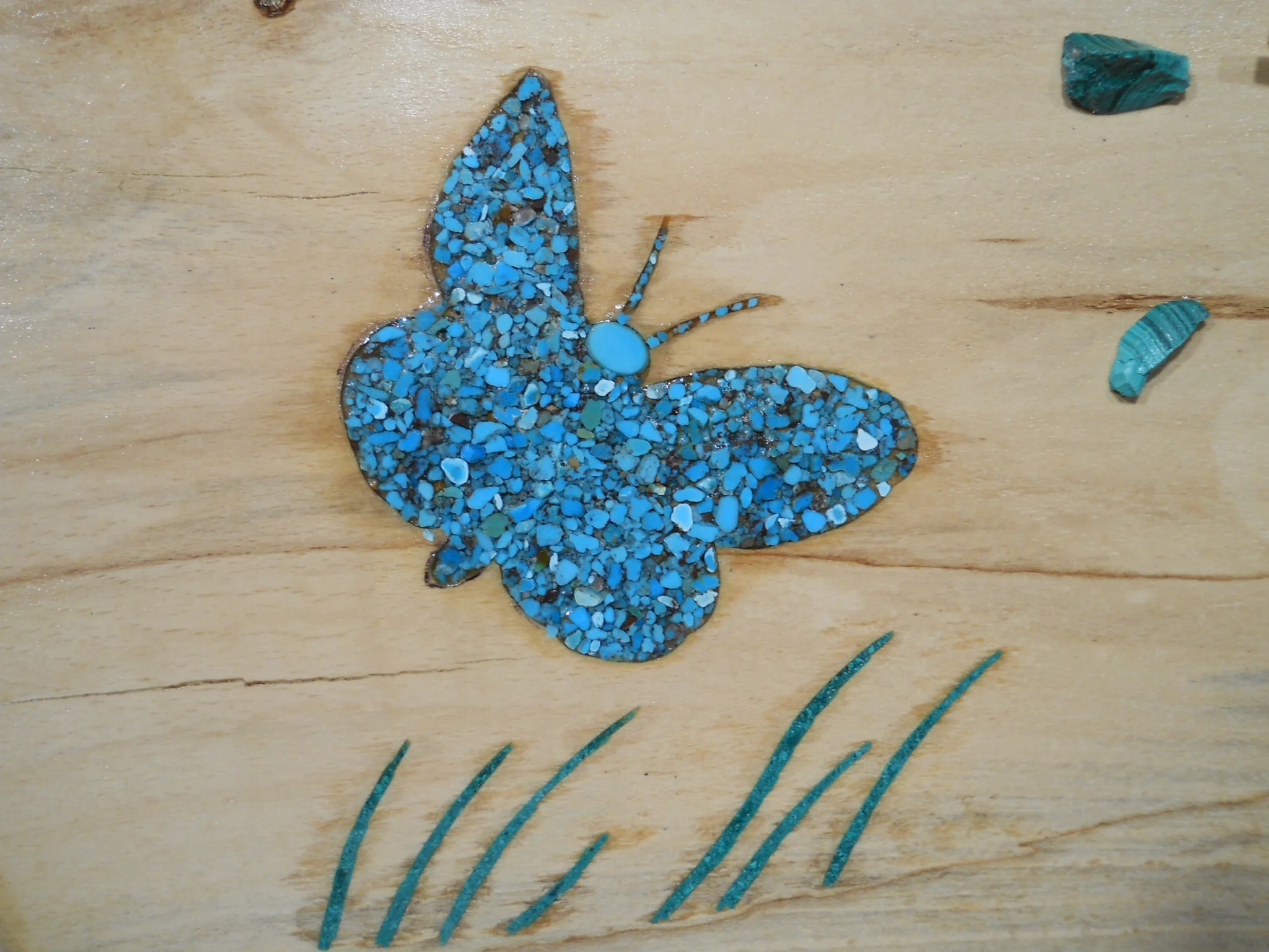  This is a detail of the maple clock with two butterflies. You can see the details of the turquoise butterfly and two of the malachite clock marks. 