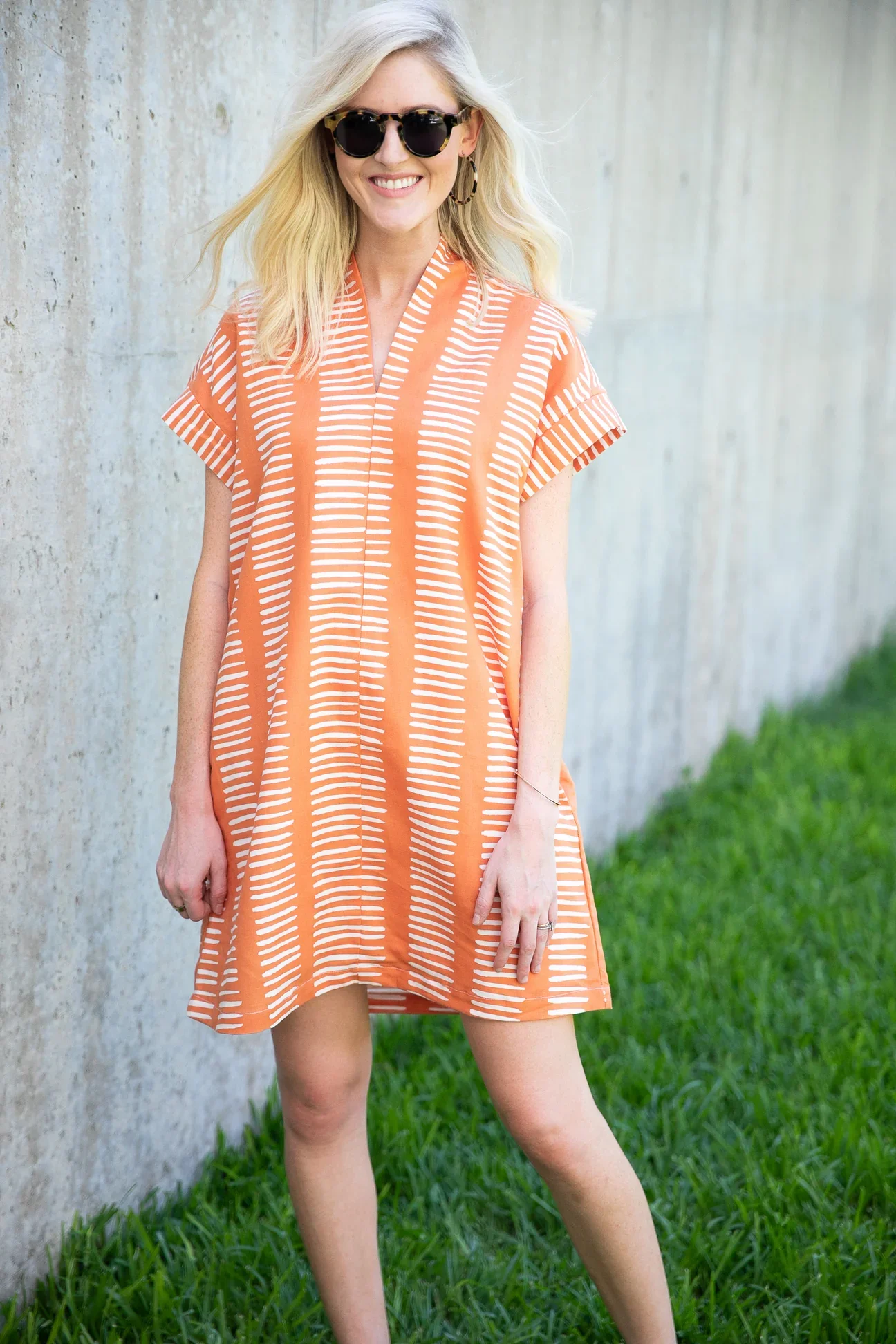 brooke wright orange dress.webp