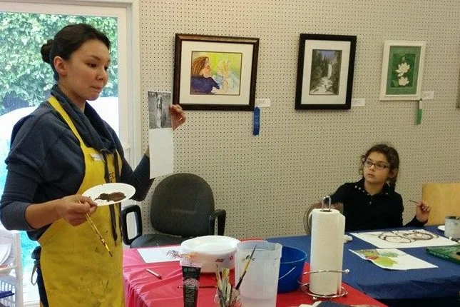 Instructor Ashley Goodman at the Camarillo Art Center, explaining how to see value in a painting.