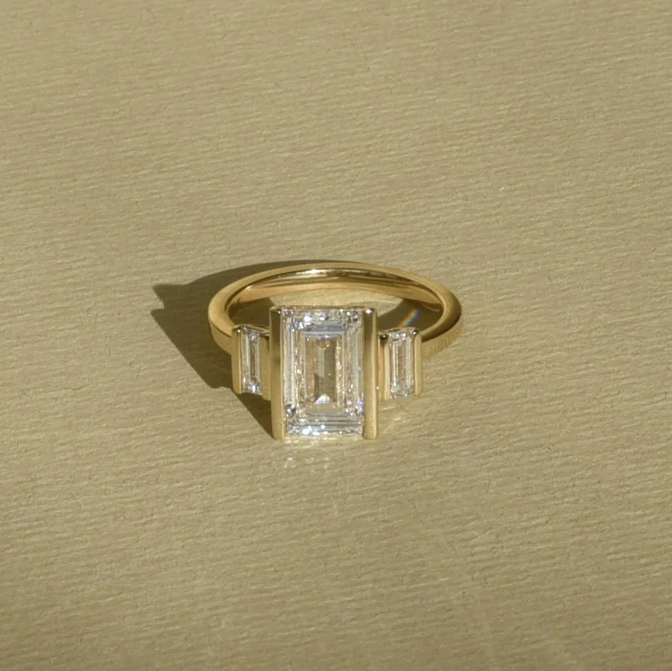 I loved working on this unique, deco inspired ring. It&rsquo;s rare to find a baguette large enough to be a center stone! The bar settings really compliment these diamonds. Congratulations Marisa and Ben ❤️❤️